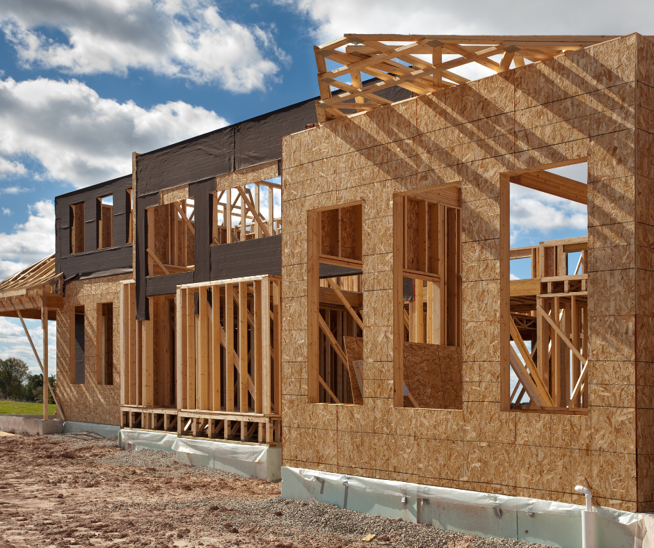 Residential construction in Jasper GA showing a new home framed with wood studs and exterior sheathing during the early construction phase