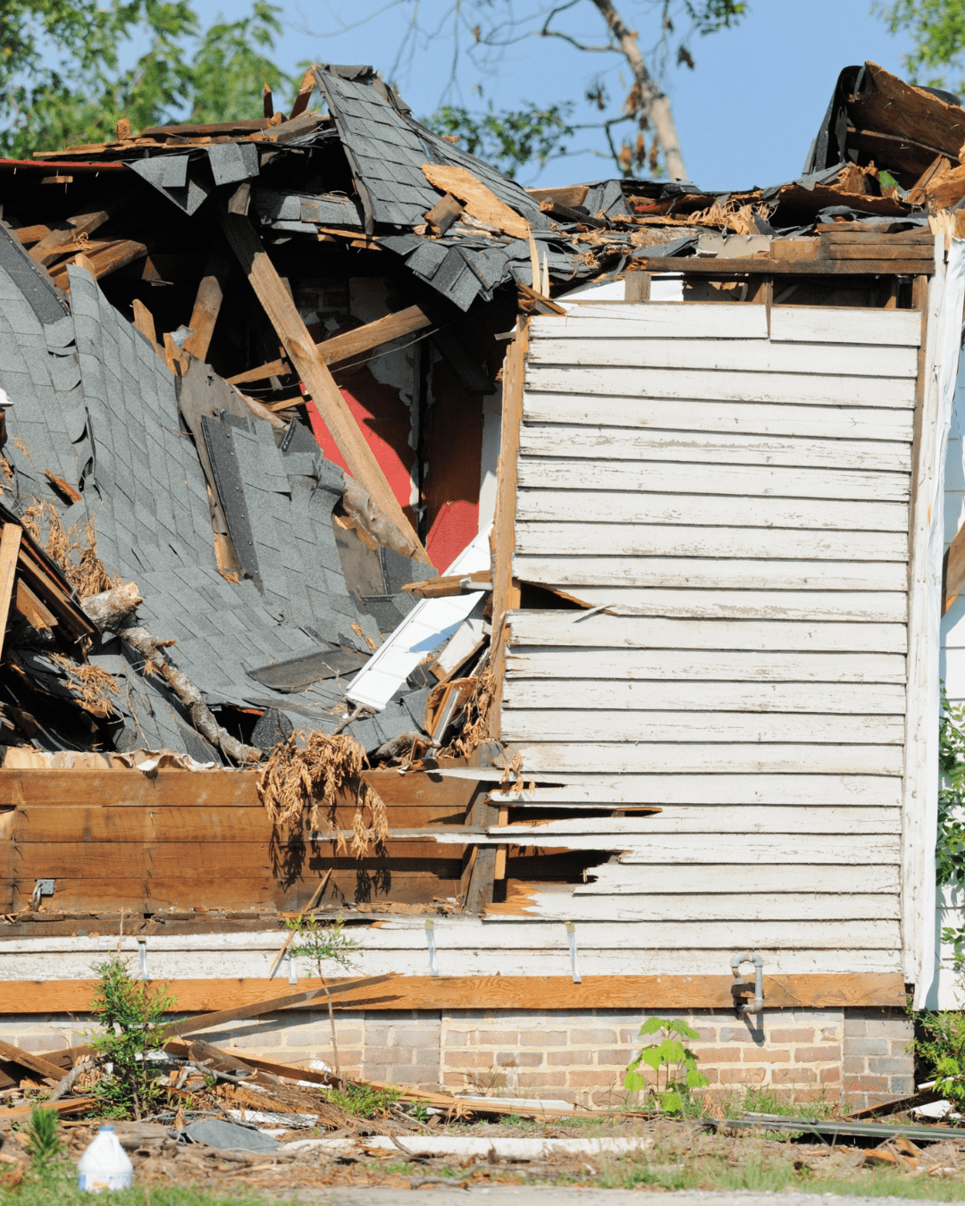 storm damage to a roof that will undergo storm damage restoration services by Global Restoration.